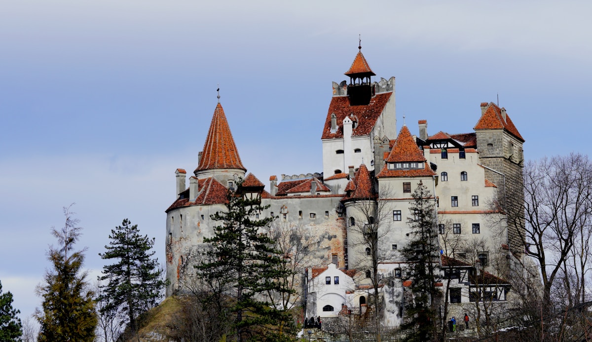 Bran Castle perched on its bluff at the edge of the Carpathians