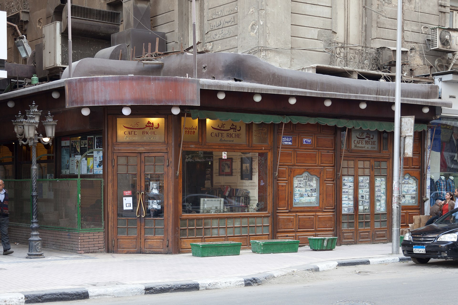 The old wooden interior and historic photographs on the walls of Café Riche in downtown Cairo