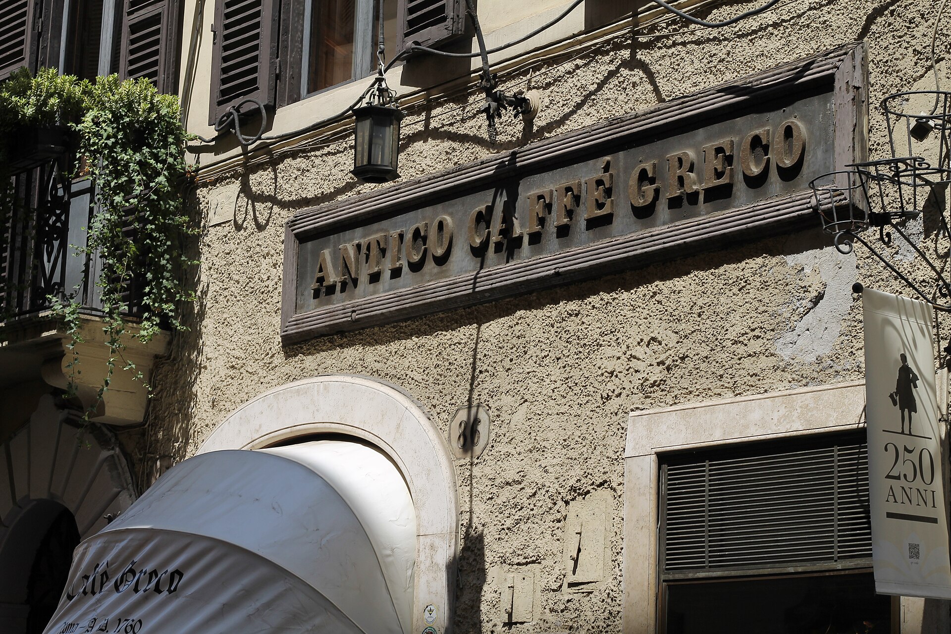 The red velvet seats, marble tables and gold-framed paintings of Antico Caffè Greco in Rome