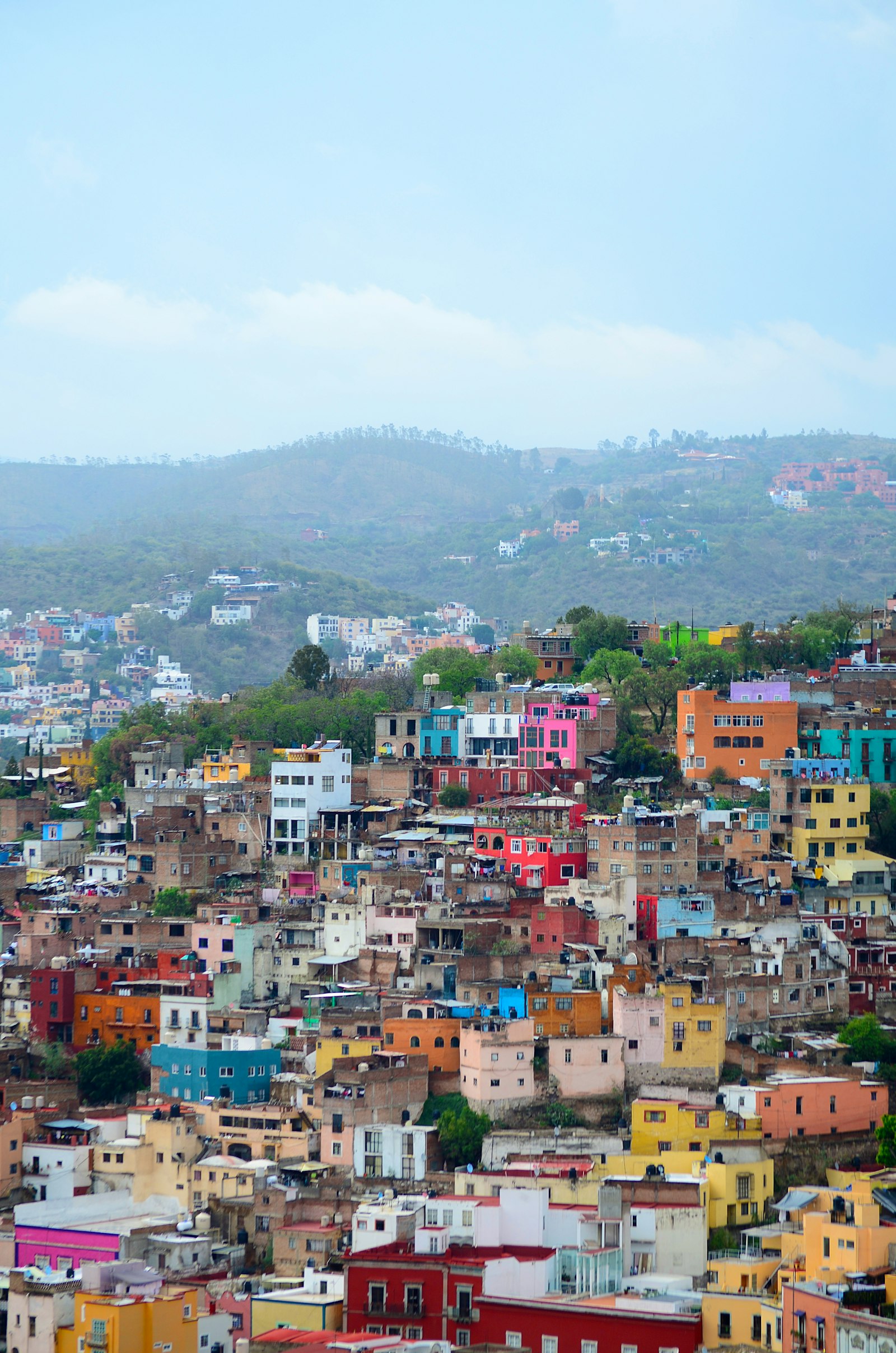 The rainbow-coloured houses of Guanajuato tumbling up the hillsides above a domed church