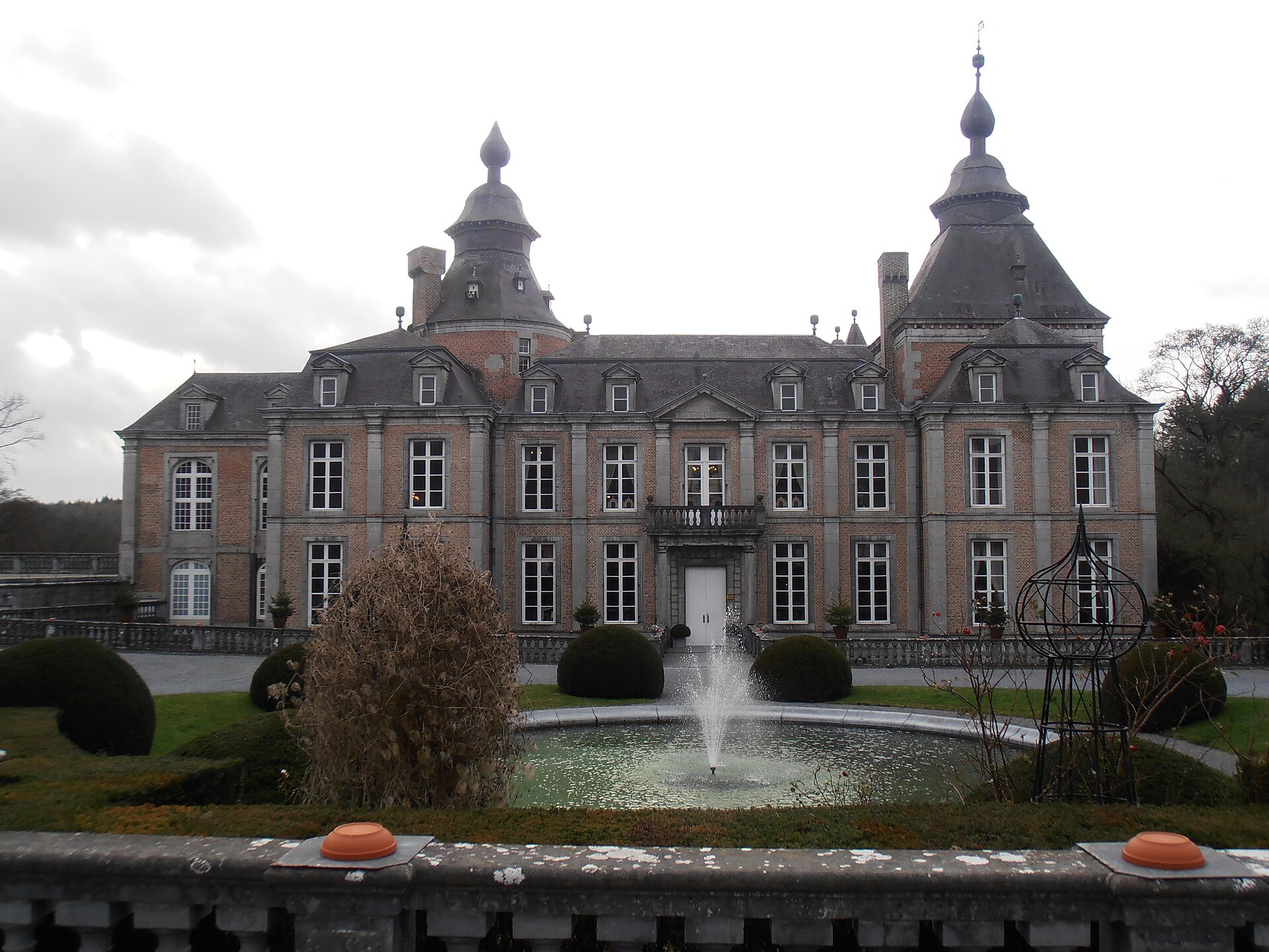 Château de Modave standing on its cliff above the wooded Hoyoux valley