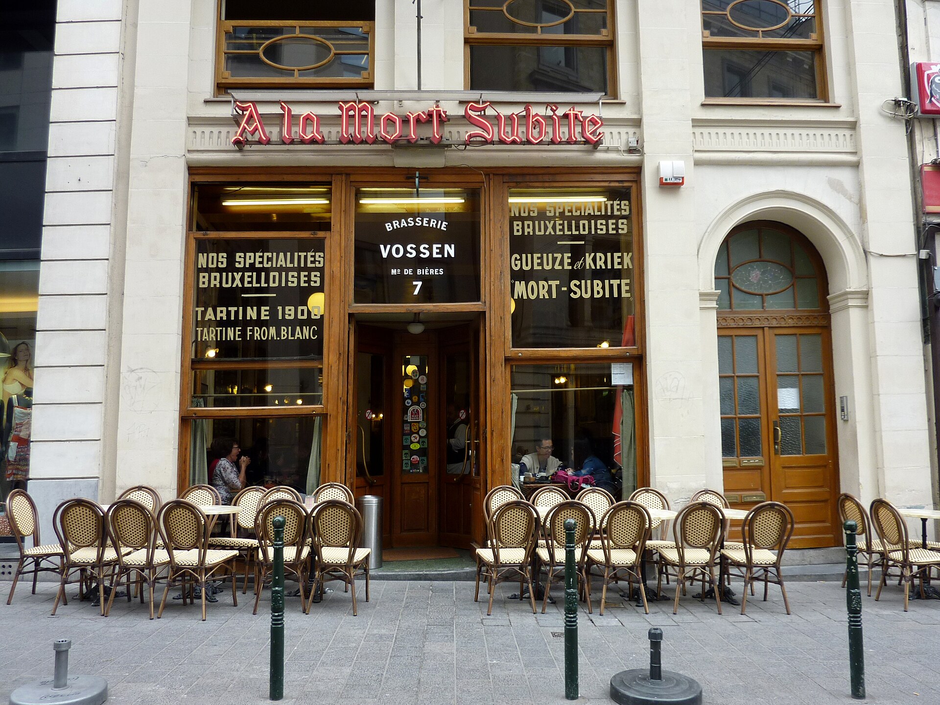 The gold-lettered windows and terrace of À la Mort Subite, a historic lambic café in Brussels