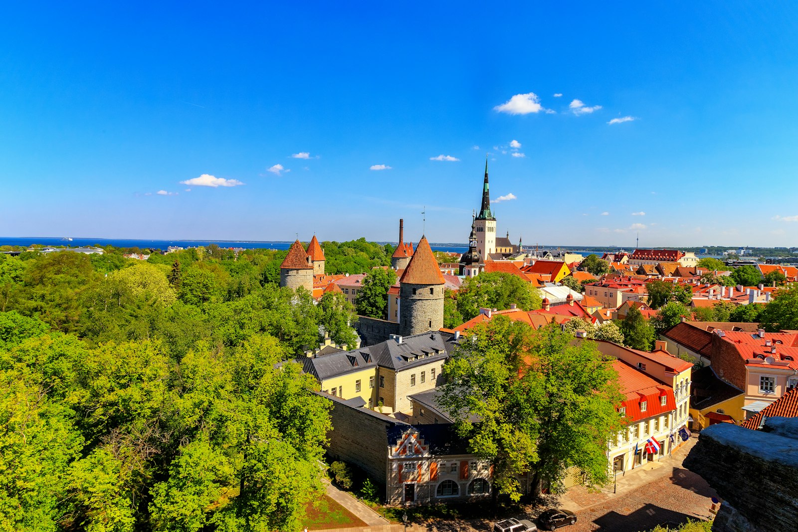 Tallinn's medieval turrets, red spires and town walls under a light dusting of snow