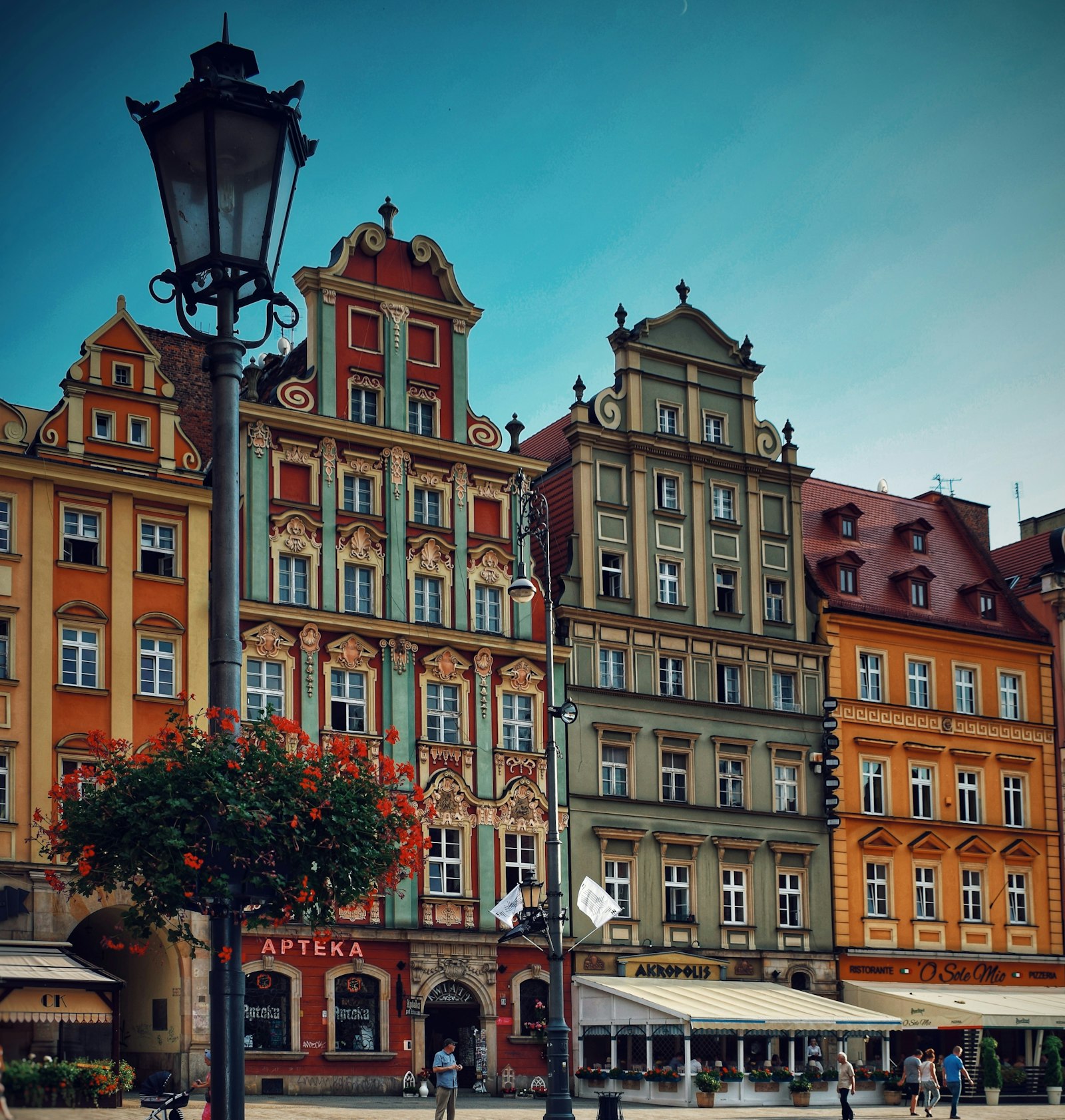 The colourful ornate façades of Wrocław's market square around its gothic town hall